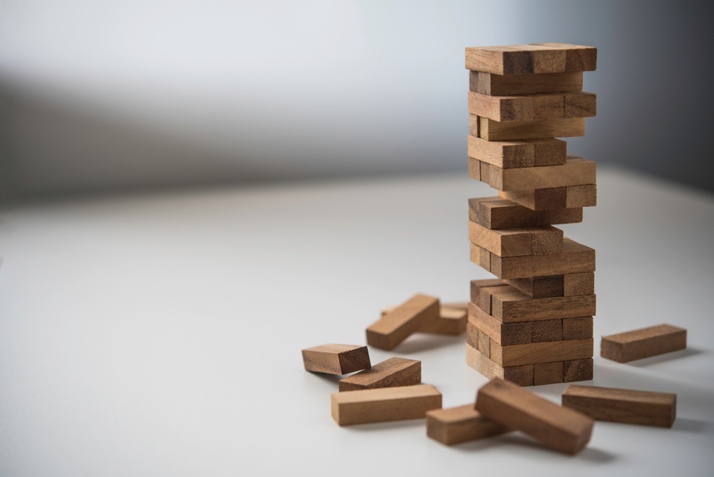 Stack of small playing blocks creating a tower.