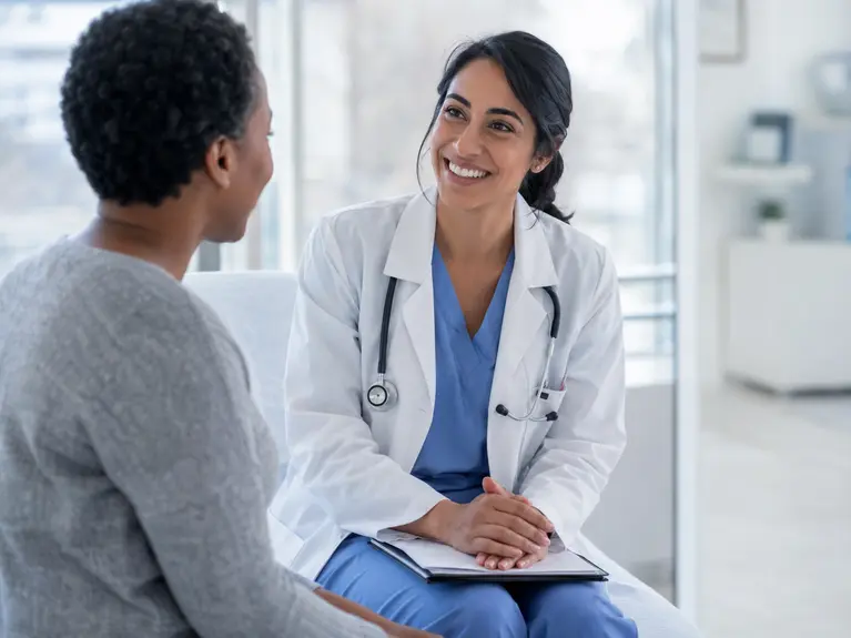 Clinician speaking with a patient